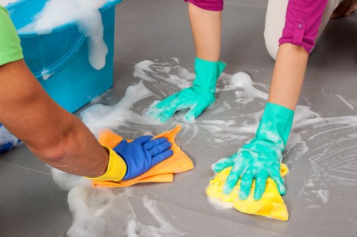 A cleaner preparing surfaces during one off cleaning in Bow