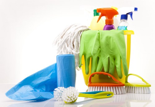 Technician wearing PPE during carpet cleaning work