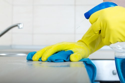 Technician performing carpet cleaning in Bow with extraction equipment